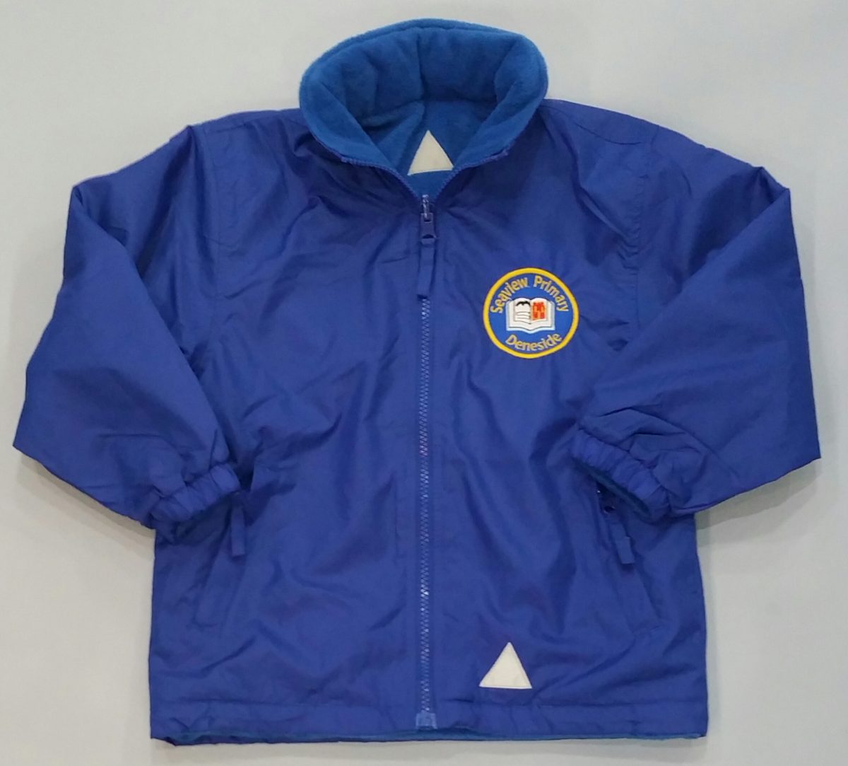 DEEP ROYAL BLUE REVERSIBLE JACKET with embroidered school logo